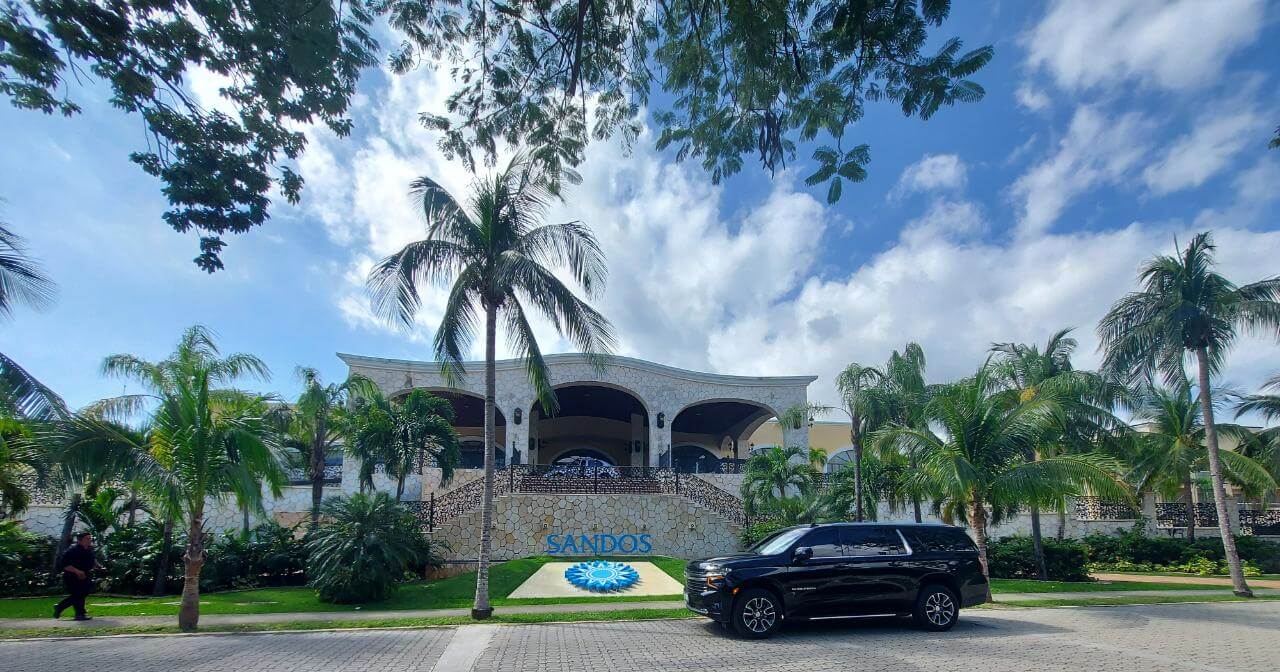 Black Luxury SUV parked in front of Sandos Playacar Resort