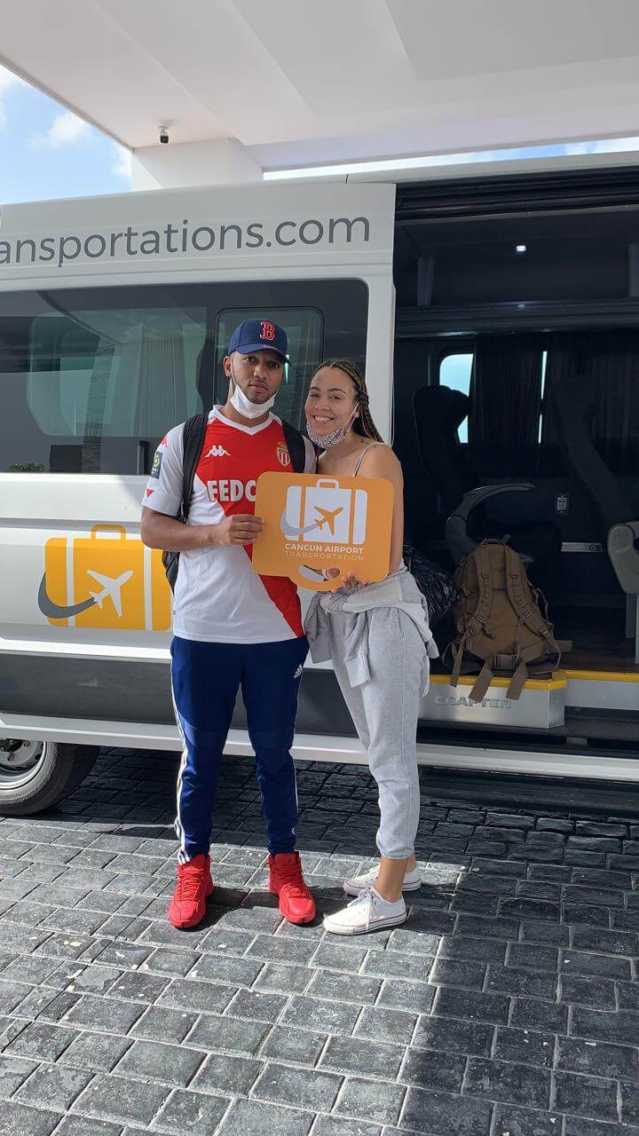 Couple arriving at their accommodation by a Group Transportation