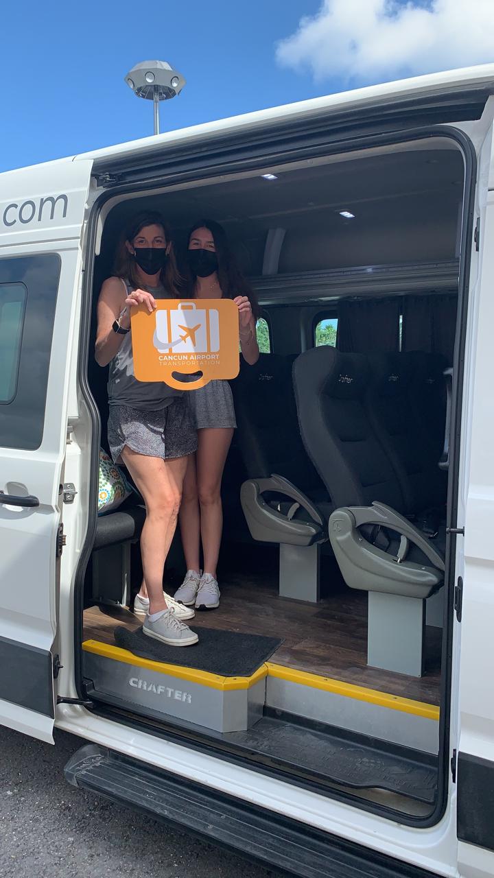 Two girls getting on board of Private Transportation van 