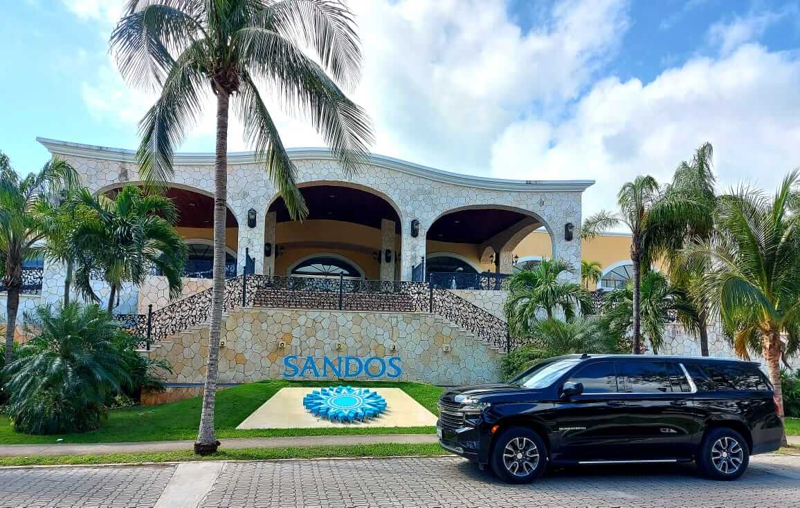 Black Suburban 2021 for Luxury Transportation parked in front of Sandos Playacar