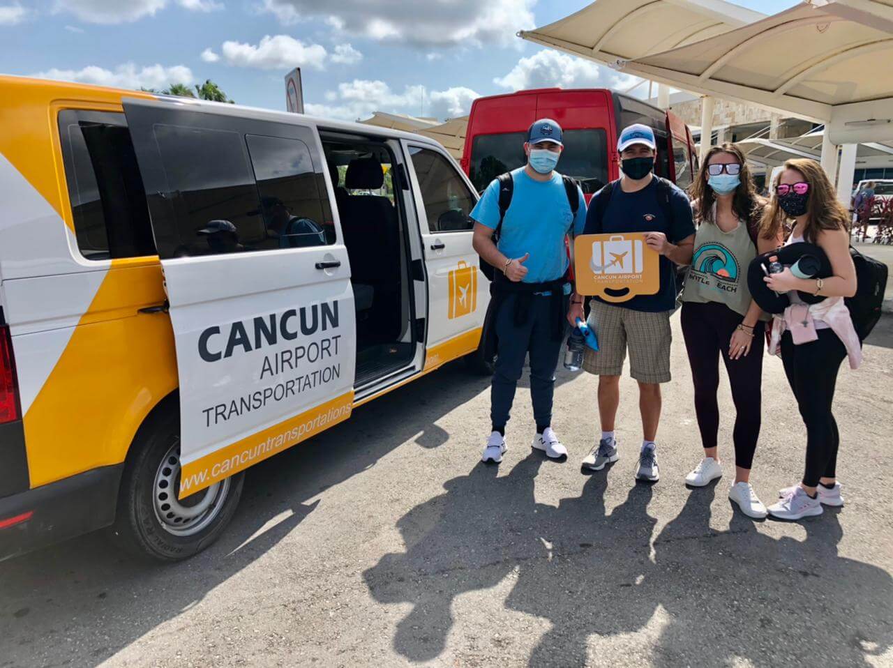 Two men and two women arriving at the airport by Private Transportation