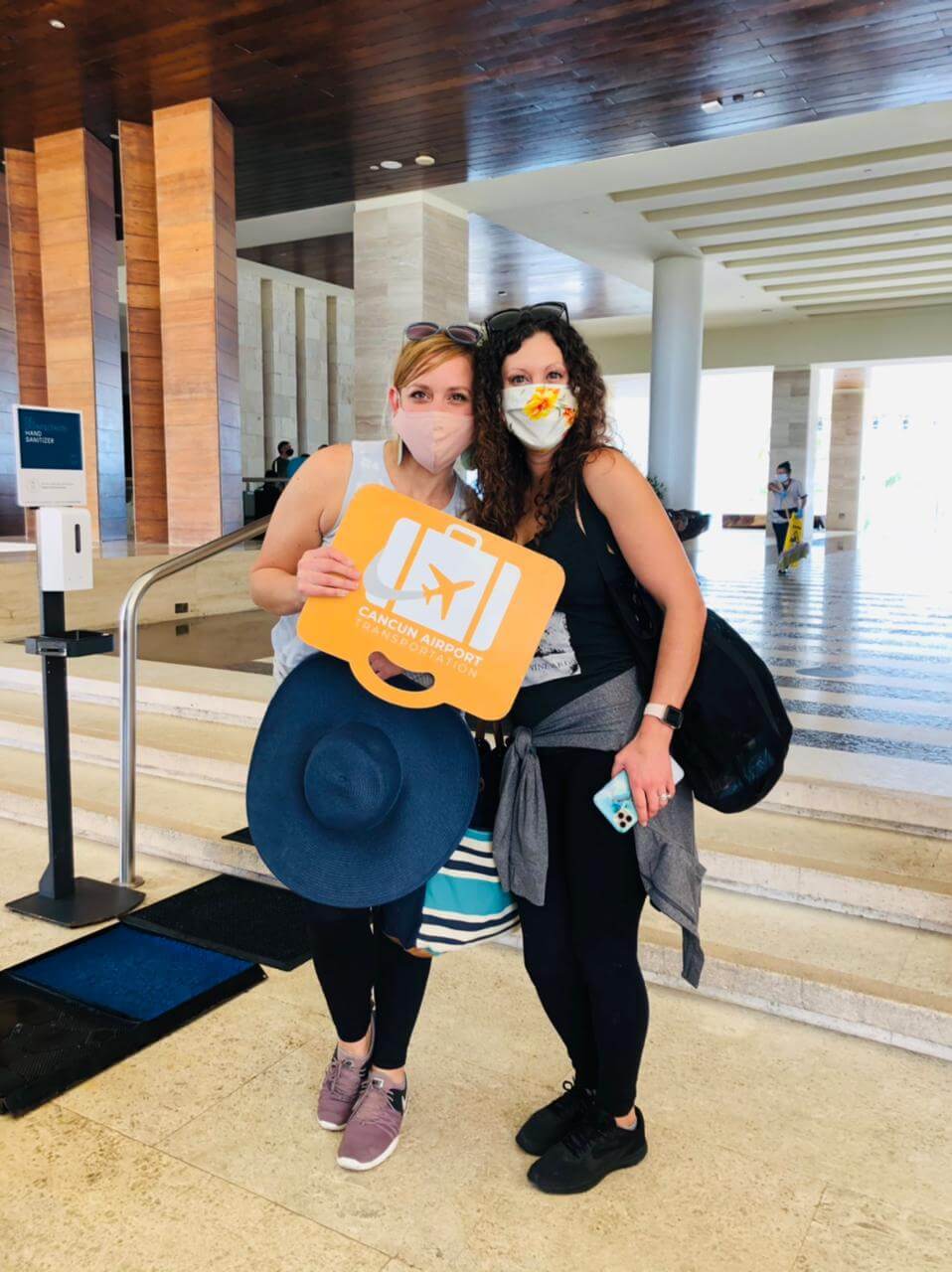 Two women at hotel lobby after transportation service