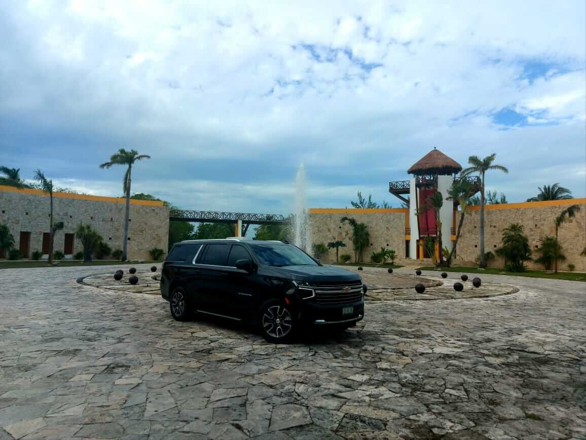Black Suburban 2021 in front of water fountain  