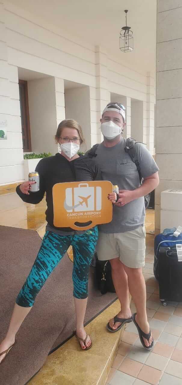 Couple enjoying beers after their transportation service